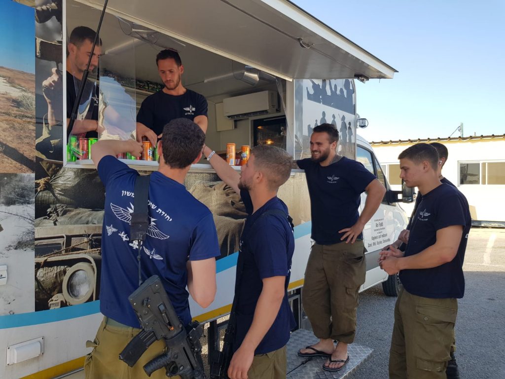 Standing Together giving treats to soldiers on duty