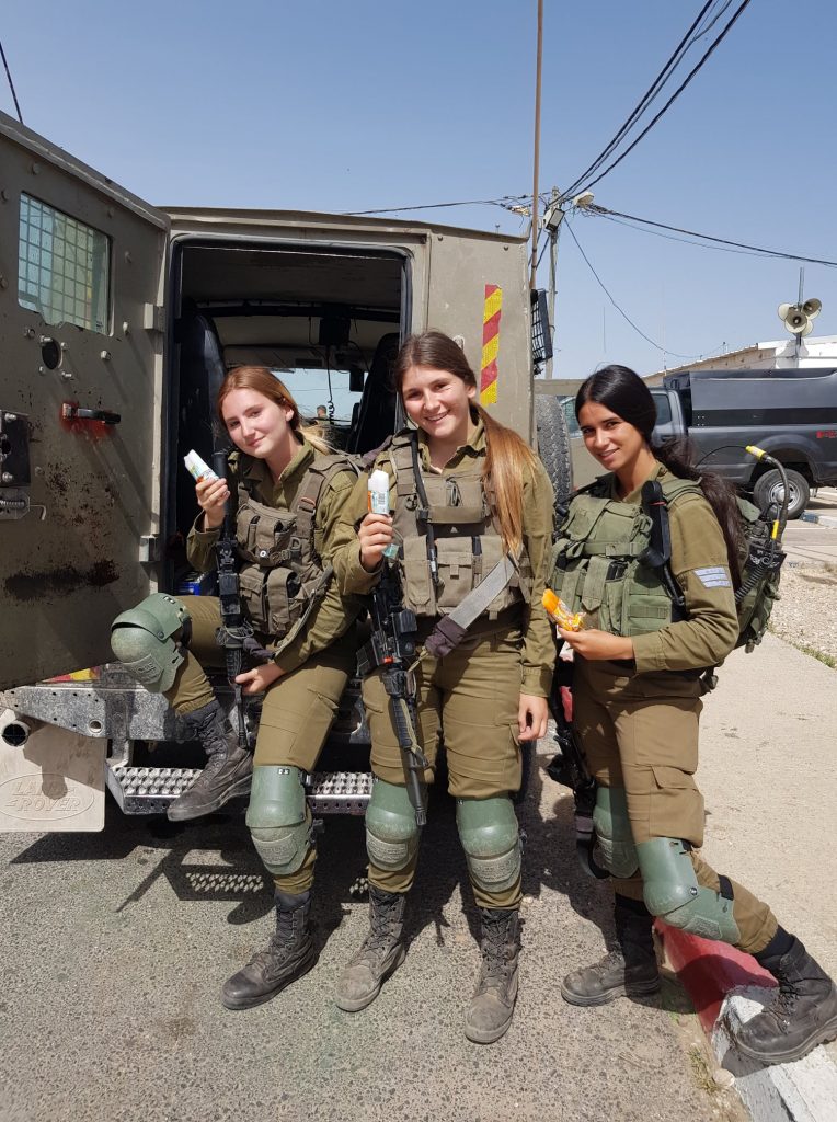 soldiers standing guard receive treats