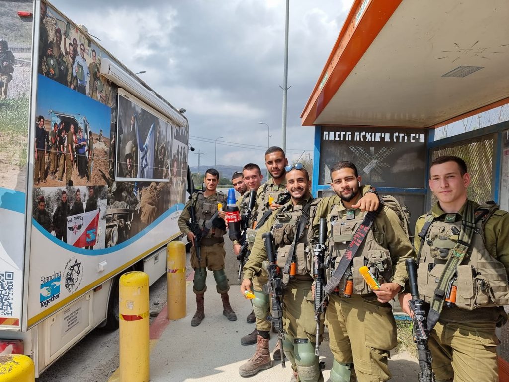 Standing Together giving treats at bus-stops