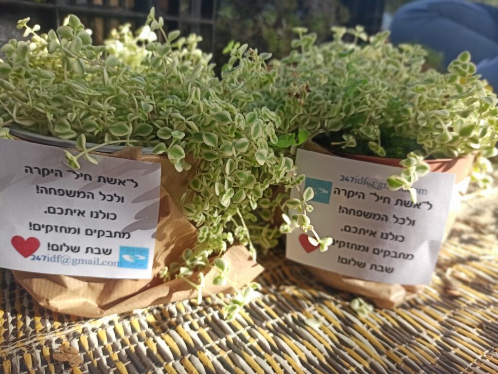 donating and giving out flowers to the wives of IDF soldiers